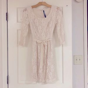 White lace dress with three-quarter length sleeves